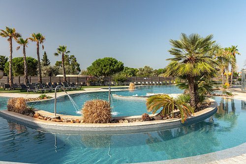 5-star resort-style camping with pools and palm trees